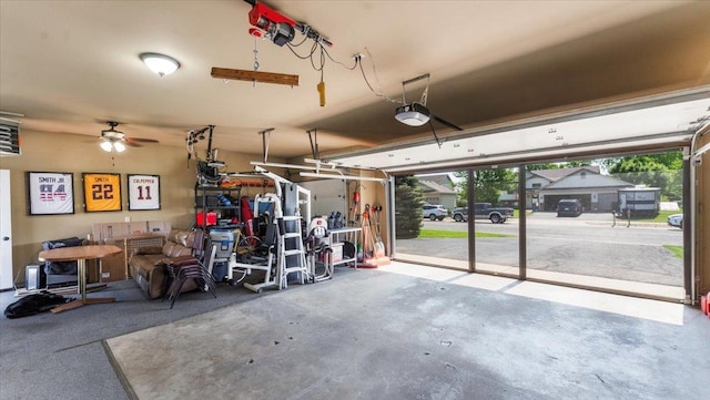 24405 18th Ave, Saint Augusta, MN 56301 - garage with a garage door opener and a ceiling fan