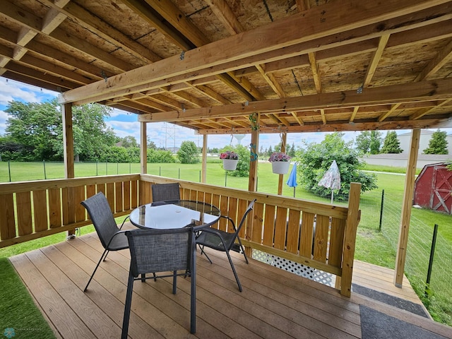 4732 San Juan Dr, Fargo, ND 58103 - wooden deck with a lawn and outdoor dining space