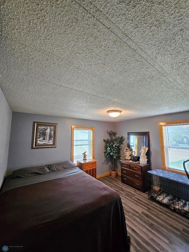 4732 San Juan Dr, Fargo, ND 58103 - bedroom featuring wood finished floors and a textured ceiling