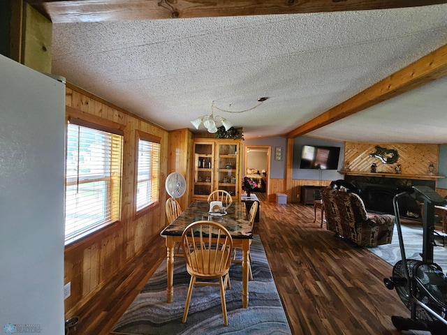 4732 San Juan Dr, Fargo, ND 58103 - dining area with wood walls, wood finished floors, a chandelier, a wainscoted wall, and a textured ceiling