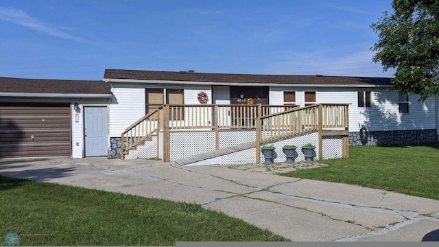 4732 San Juan Dr, Fargo, ND 58103 - view of front of house featuring a front lawn, a deck, and a garage