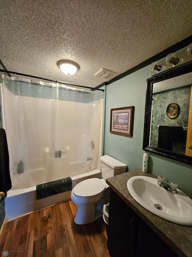 4732 San Juan Dr, Fargo, ND 58103 - full bath featuring a textured ceiling, a textured wall, shower / tub combo with curtain, vanity, and toilet