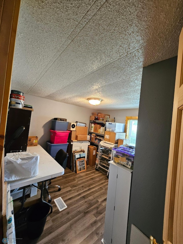 4732 San Juan Dr, Fargo, ND 58103 - office space featuring dark wood-style floors and a textured ceiling