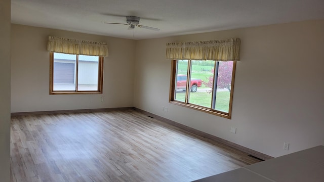 3454 44th Ave SW, Pine River, MN 56474 - spare room with wood finished floors, ceiling fan, and baseboards