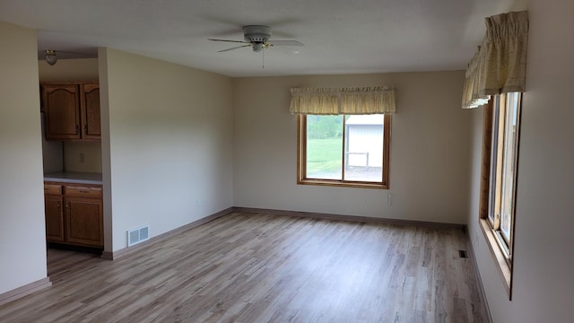 3454 44th Ave SW, Pine River, MN 56474 - empty room with light wood finished floors, a ceiling fan, and baseboards