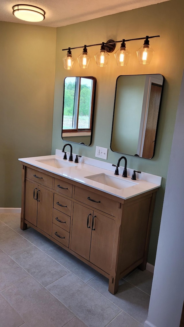 3454 44th Ave SW, Pine River, MN 56474 - full bathroom featuring double vanity, tile patterned floors, and baseboards