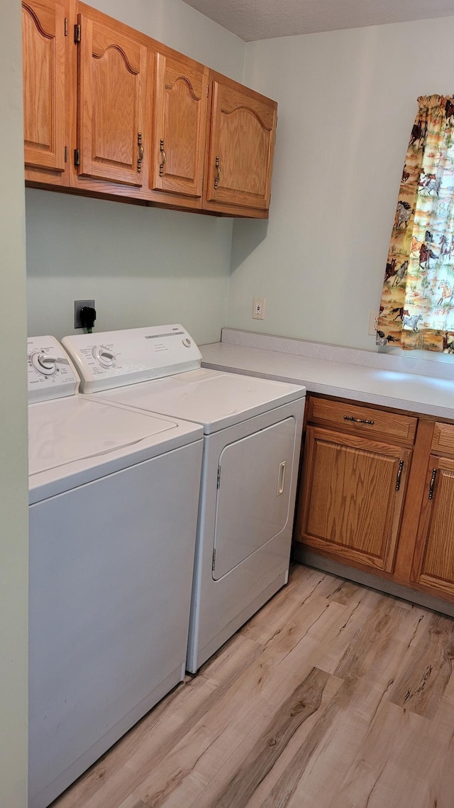 3454 44th Ave SW, Pine River, MN 56474 - laundry area with cabinet space, separate washer and dryer, and light wood-style floors