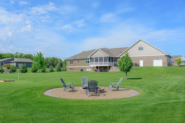 2142 Monarch Ct, Sartell, MN 56377 - rear view of property with a fire pit, a lawn, and a sunroom