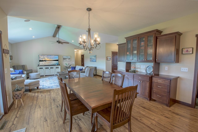 2142 Monarch Ct, Sartell, MN 56377 - dining area featuring light wood finished floors, a ceiling fan, a chandelier, and baseboards