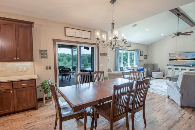2142 Monarch Ct, Sartell, MN 56377 - dining area featuring light wood-type flooring, a chandelier, and a ceiling fan