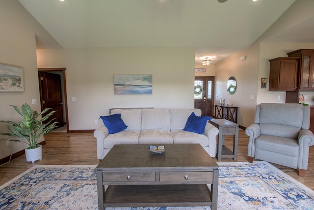 2142 Monarch Ct, Sartell, MN 56377 - living room featuring lofted ceiling, light wood-style flooring, baseboards, and recessed lighting