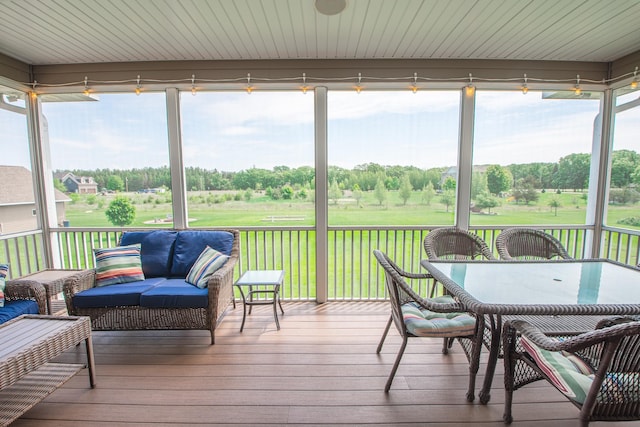 2142 Monarch Ct, Sartell, MN 56377 - sunroom with healthy amount of natural light, outdoor dining space, and view of golf course