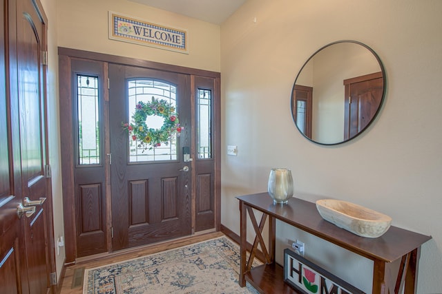 2142 Monarch Ct, Sartell, MN 56377 - foyer entrance with light wood-style floors and baseboards
