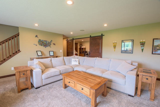 2142 Monarch Ct, Sartell, MN 56377 - living room with a barn door, light carpet, recessed lighting, and stairs