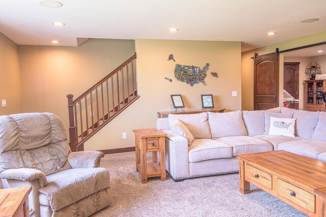 2142 Monarch Ct, Sartell, MN 56377 - living area featuring a barn door, light colored carpet, stairway, recessed lighting, and a textured ceiling