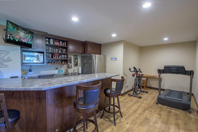2142 Monarch Ct, Sartell, MN 56377 - indoor wet bar featuring stainless steel appliances, light wood-style flooring, recessed lighting, and baseboards