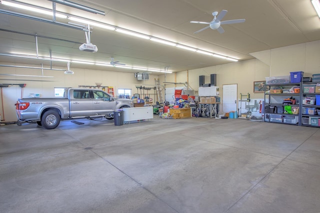 2142 Monarch Ct, Sartell, MN 56377 - garage featuring a garage door opener and ceiling fan