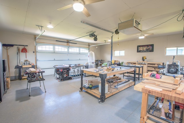 2142 Monarch Ct, Sartell, MN 56377 - garage featuring a workshop area and a ceiling fan