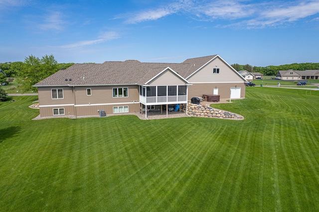 2142 Monarch Ct, Sartell, MN 56377 - back of house with a sunroom, a yard, and central AC