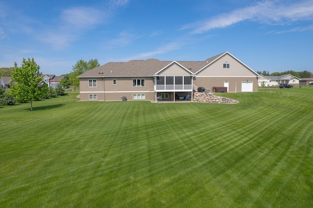 2142 Monarch Ct, Sartell, MN 56377 - rear view of property with a sunroom, a lawn, and central AC unit