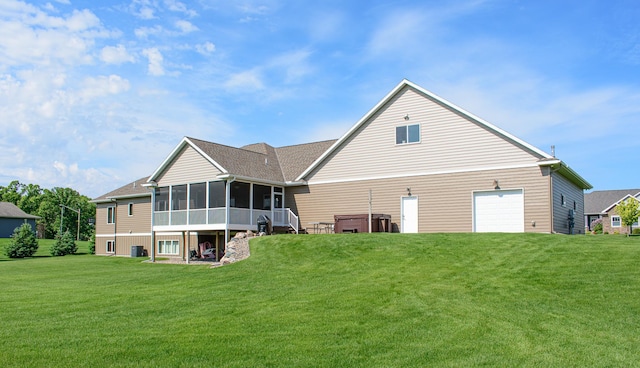 2142 Monarch Ct, Sartell, MN 56377 - rear view of property featuring a sunroom, a yard, a garage, and cooling unit