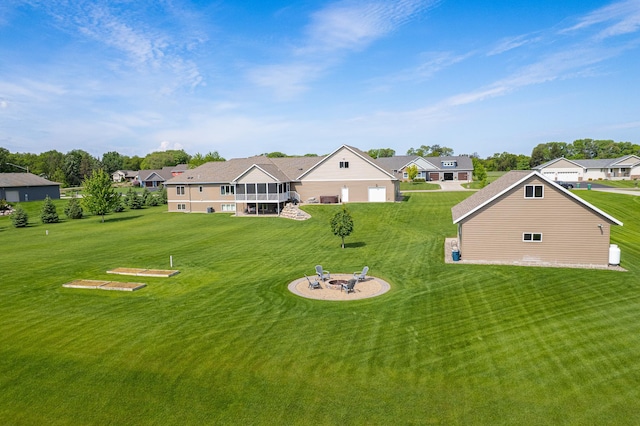 2142 Monarch Ct, Sartell, MN 56377 - rear view of property featuring a fire pit, a lawn, and a residential view