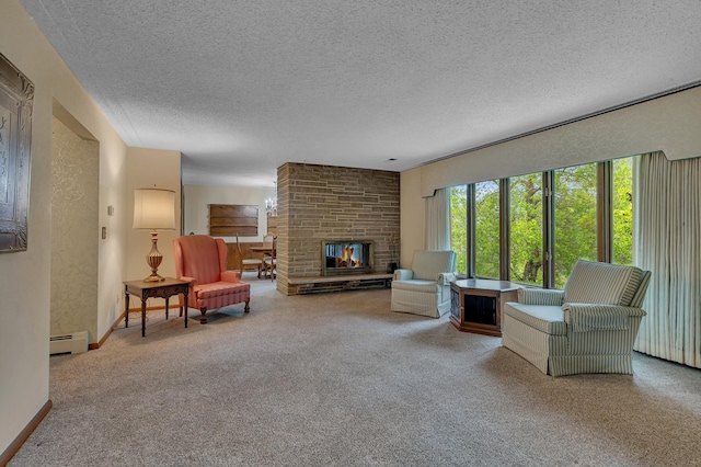 2916 Golf View Ct, Saint Cloud, MN 56301 - living area featuring a baseboard heating unit, a textured ceiling, a brick fireplace, carpet, and baseboards