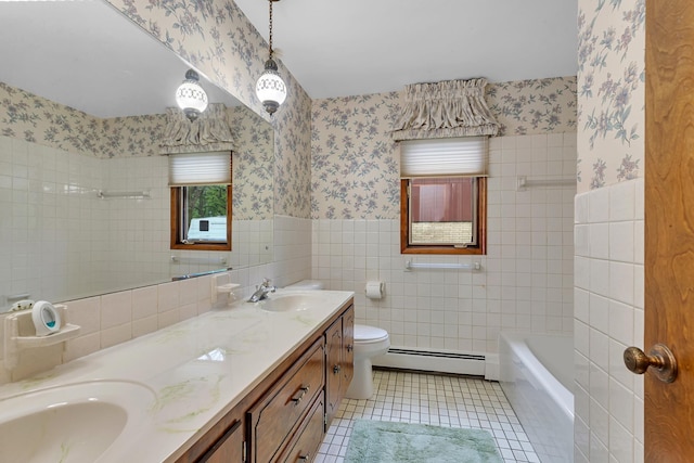 2916 Golf View Ct, Saint Cloud, MN 56301 - bathroom featuring baseboard heating, wallpapered walls, tile walls, a wainscoted wall, and double vanity
