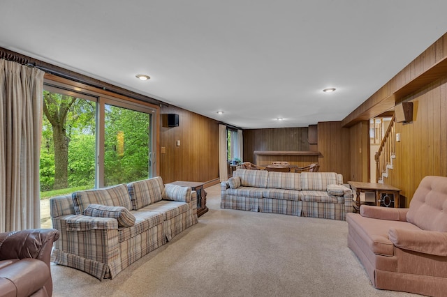2916 Golf View Ct, Saint Cloud, MN 56301 - carpeted living area featuring wood walls and stairway