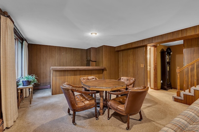 2916 Golf View Ct, Saint Cloud, MN 56301 - dining space with light carpet, wood walls, stairs, baseboard heating, and a bar