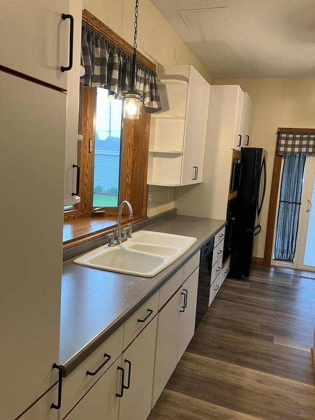 903 2nd St, Princeton, MN 55371 - kitchen with open shelves, black appliances, a sink, dark wood-style flooring, and white cabinets