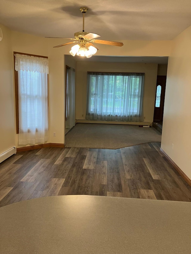 903 2nd St, Princeton, MN 55371 - unfurnished room featuring a ceiling fan, healthy amount of natural light, and wood finished floors