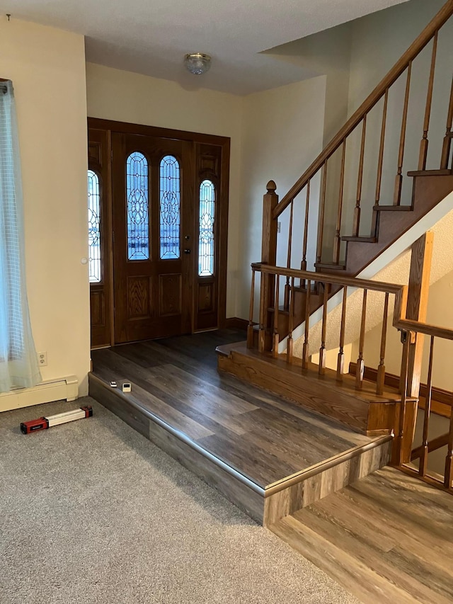 903 2nd St, Princeton, MN 55371 - foyer featuring plenty of natural light, wood finished floors, and stairway