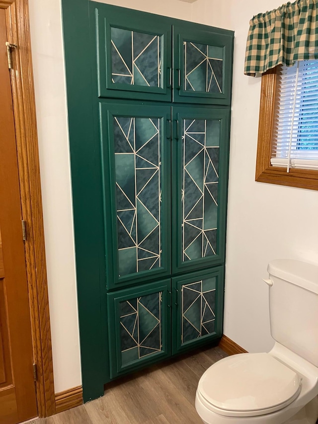 903 2nd St, Princeton, MN 55371 - bathroom featuring toilet and wood finished floors