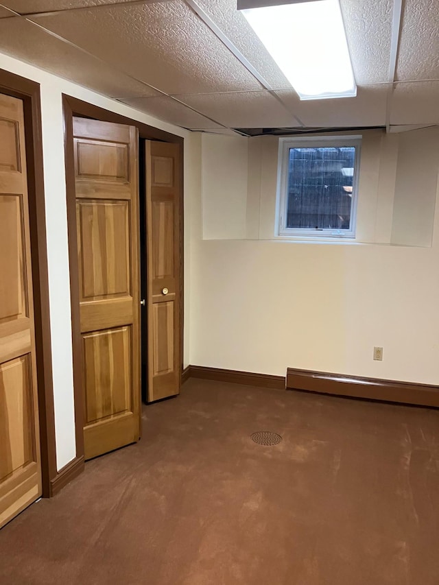 903 2nd St, Princeton, MN 55371 - finished basement with baseboard heating, baseboards, and carpet flooring