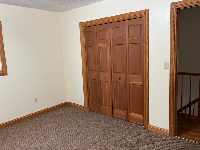 903 2nd St, Princeton, MN 55371 - unfurnished bedroom with carpet, baseboards, and a closet