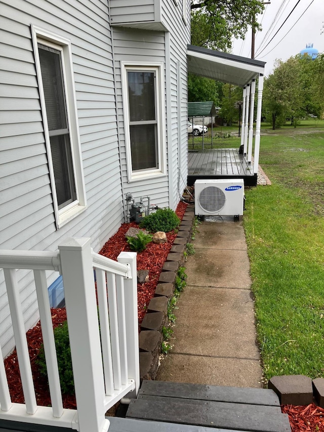 903 2nd St, Princeton, MN 55371 - view of green lawn with a cooling unit and a deck