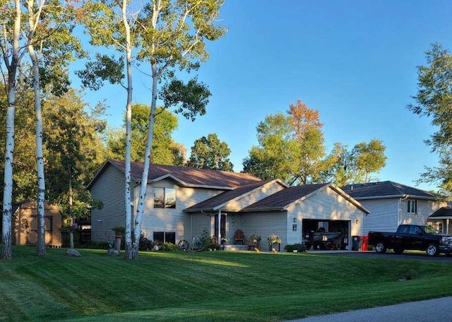 205 Darling Pl, Alexandria, MN 56308 - tri-level home featuring a garage and a front yard