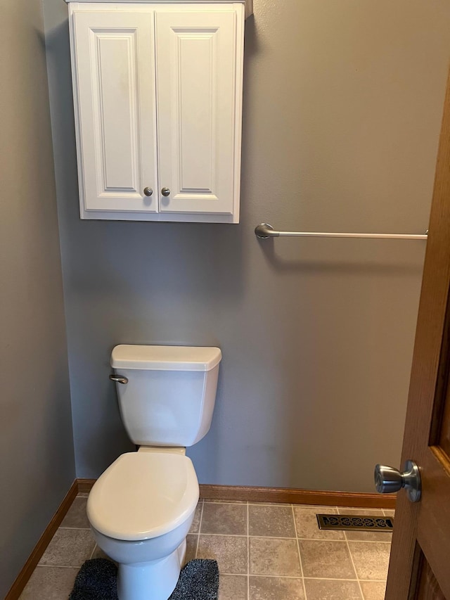 205 Darling Pl, Alexandria, MN 56308 - bathroom with baseboards, toilet, and tile patterned flooring