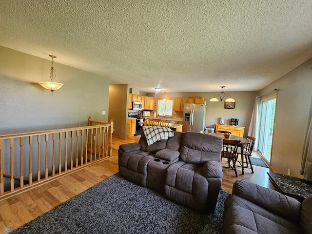 2904 17th Ave S, Moorhead, MN 56560 - living room featuring light wood-style floors and a textured ceiling