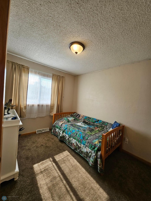 2904 17th Ave S, Moorhead, MN 56560 - bedroom with carpet floors and a textured ceiling