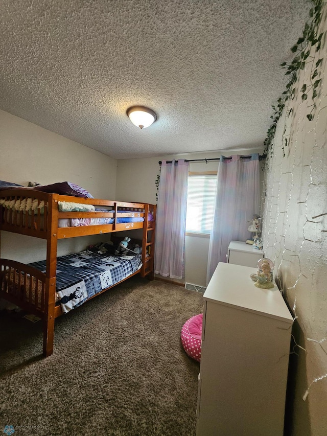 2904 17th Ave S, Moorhead, MN 56560 - carpeted bedroom with a textured ceiling