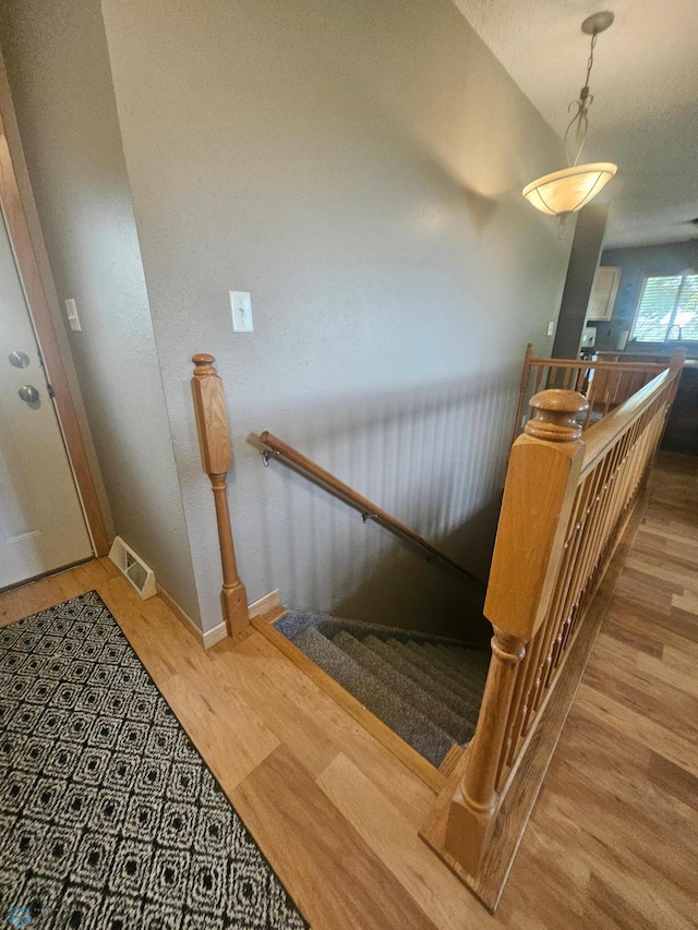 2904 17th Ave S, Moorhead, MN 56560 - staircase with wood finished floors and baseboards