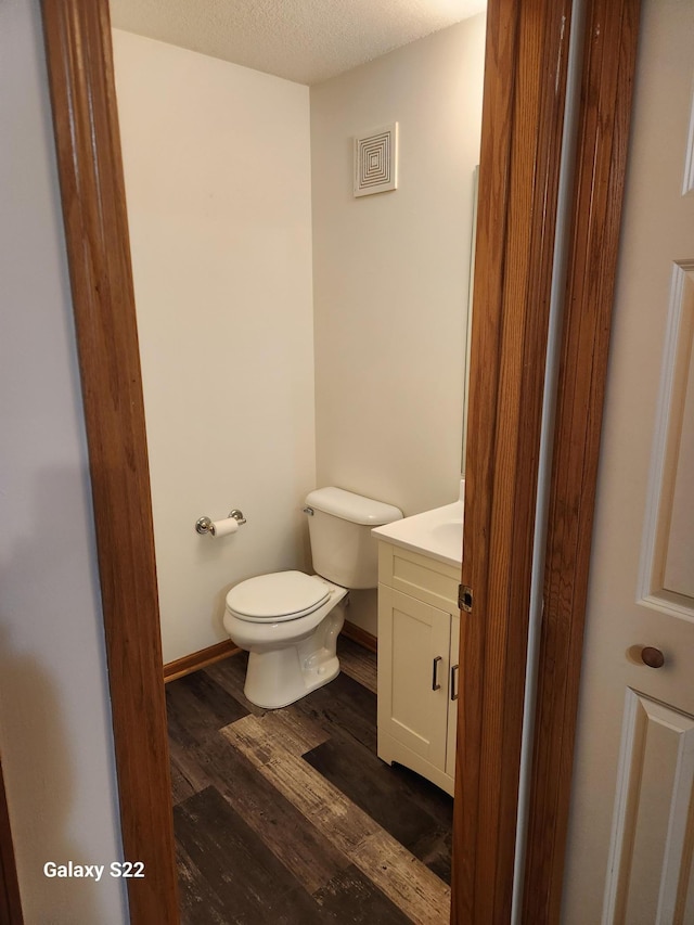 6454 Appaloosa Ave S, Forest Lake, MN 55025 - half bathroom with toilet, vanity, and wood finished floors
