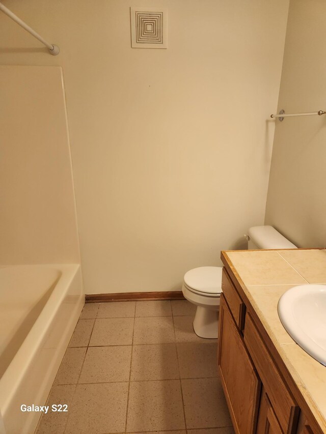 6454 Appaloosa Ave S, Forest Lake, MN 55025 - bathroom featuring toilet, baseboards, and vanity