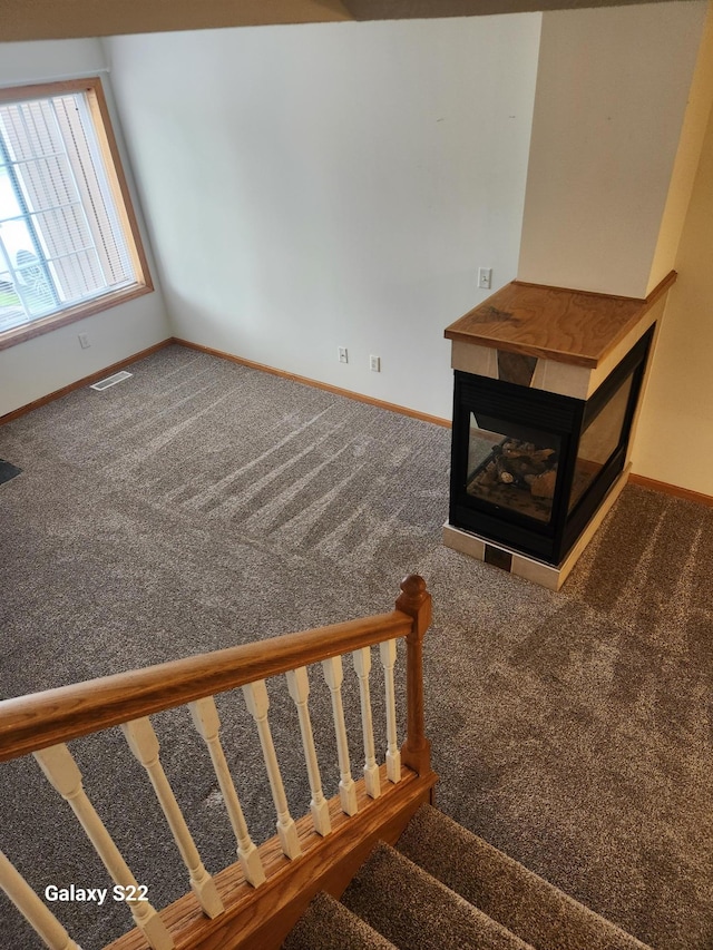 6454 Appaloosa Ave S, Forest Lake, MN 55025 - staircase with baseboards, carpet flooring, and a multi sided fireplace
