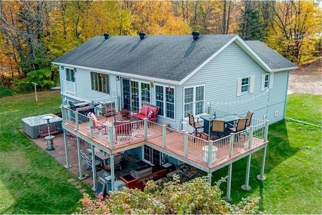 28320 State Highway 65, Pengilly, MN 55775 - rear view of house featuring a wooden deck, a yard, and roof with shingles