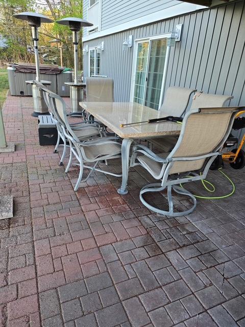 28320 State Highway 65, Pengilly, MN 55775 - view of patio / terrace with a hot tub and outdoor dining space