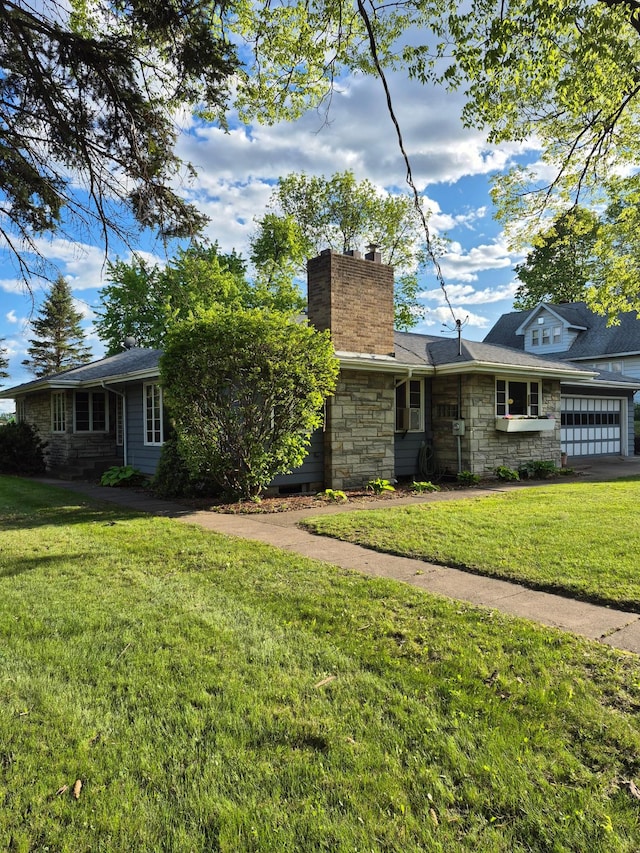 227 Summit Ave, Grantsburg, WI 54840 - view of front of home with stone siding, a front lawn, a chimney, and an attached garage