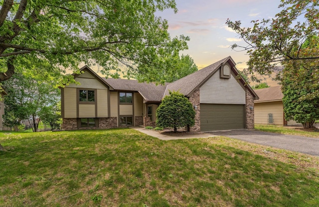 7150 Upper 157th St W, Apple Valley, MN 55124 - view of front of home featuring driveway, an attached garage, a lawn, and a shingled roof